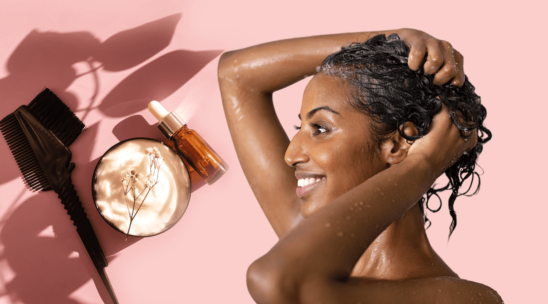 Black woman applying her DIY deep conditioning shea butter masque for dry hair.