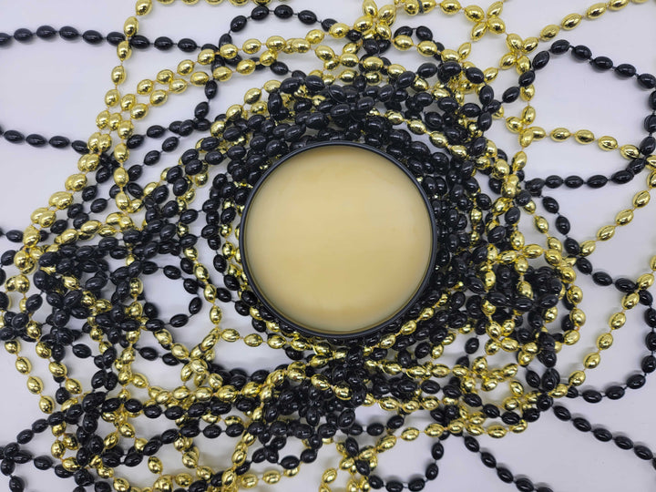 Open 4 oz tin of Citrus Crush Beard Balm made with shea butter, apricot & rosehip oil & other 100% natural ingredients.