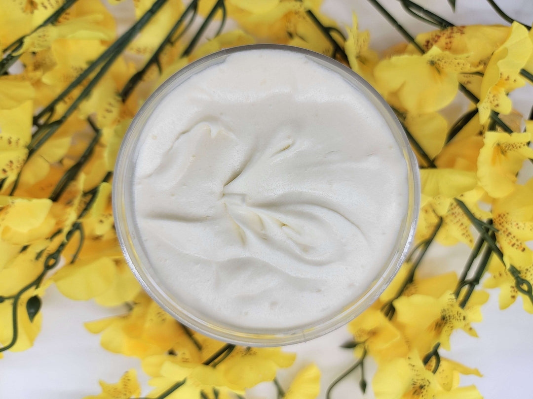 Open 8 oz jar of creamy Honey Flower Bomb whipped shea butter made with the best ingredients Mother Nature has to offer.