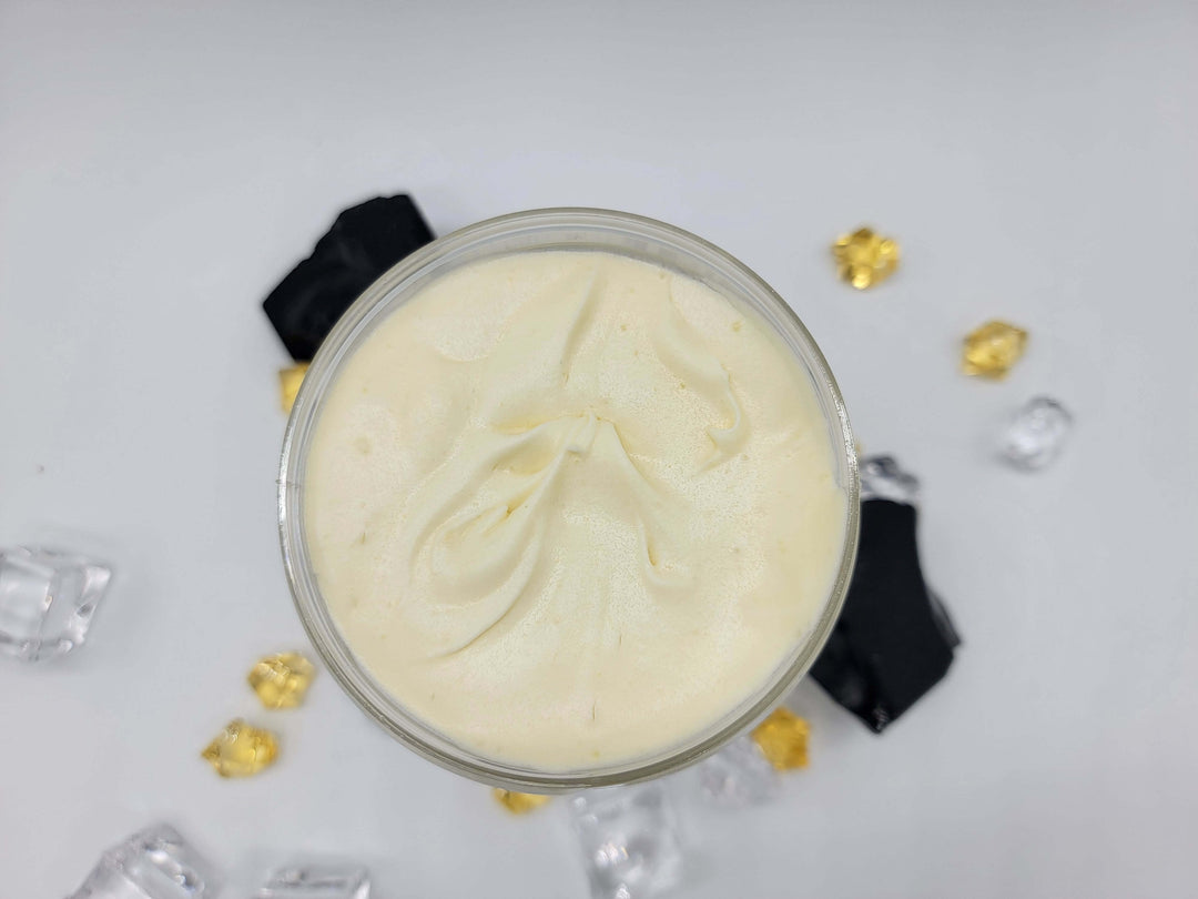 Open jar of sveltelty, silky, whipped shea butter for men and women made with jojoba, rosehip, apricot & other premium oils. 